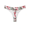 A thong panty with a multicolored floral pattern on a white background.