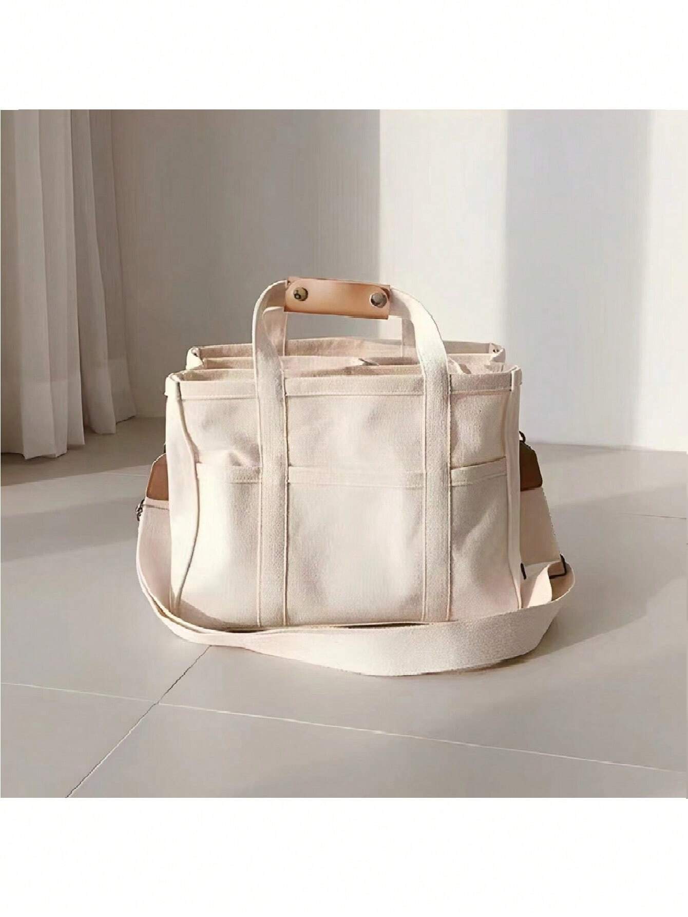 Buy SHEIN 1pc Fashionable Mommy Bag Large Capacity Canvas Shoulder Bag Crossbody Bag Portable Baby Product Storage Bag For Outings in Pakistan