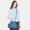 Buy Tory Burch Charlie Quilted Denim Drawstring Shoulder Bag in Pakistan