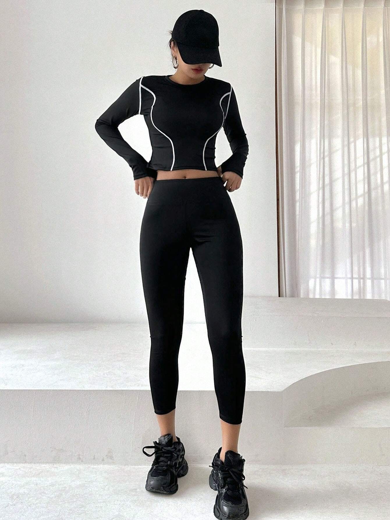 Buy SHEIN DAZY Women'S Color Block Rolled Edge Top With Solid Color Leggings Two Piece Set in Pakistan