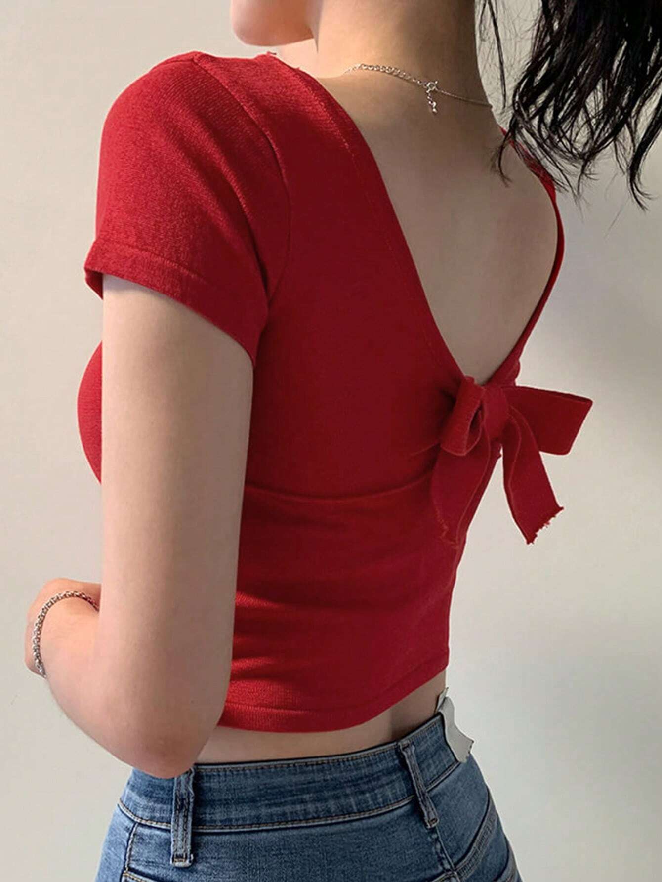 Buy SHEIN DAZY Women's Solid Color Backless Bow Knit Crop Top in Pakistan