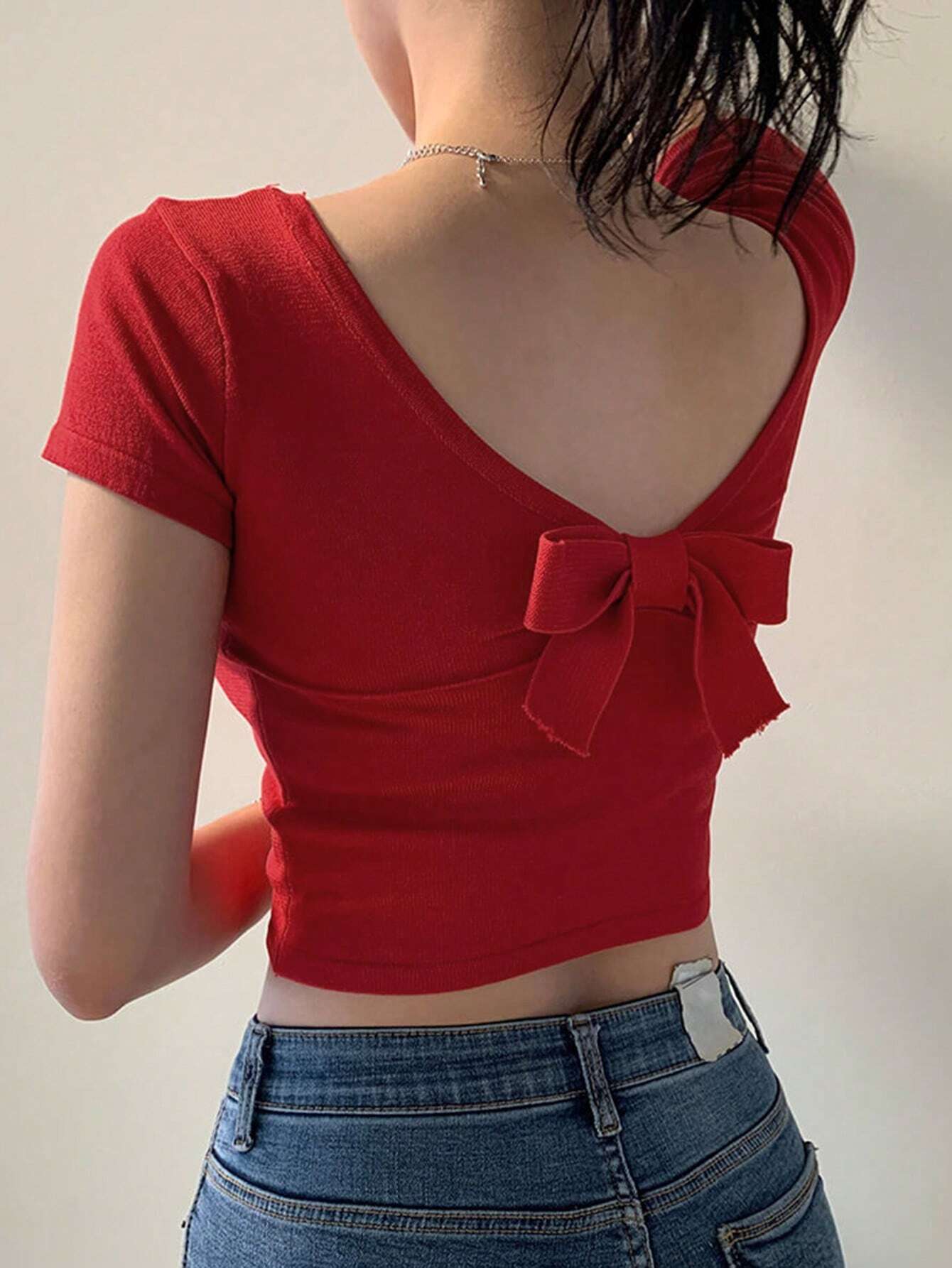 Buy SHEIN DAZY Women's Solid Color Backless Bow Knit Crop Top in Pakistan