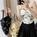 Buy Florea - Floral Asymmetrical Camisole Top - Black in Pakistan