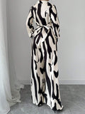 Buy SHEIN Privé Women's Contrast Color Printed Long Sleeve Tie Front Jumpsuit in Pakistan