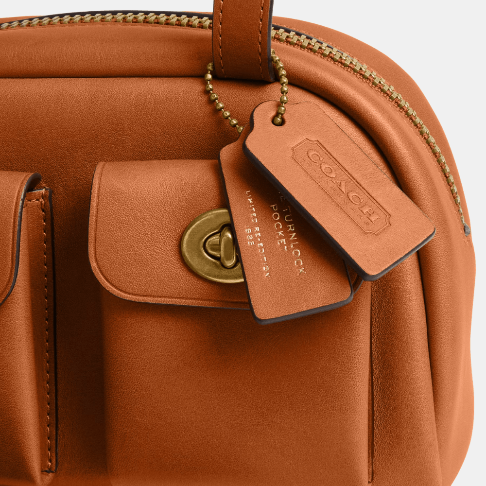 Buy Coach Twin Turnlock 20 Bag in Pakistan