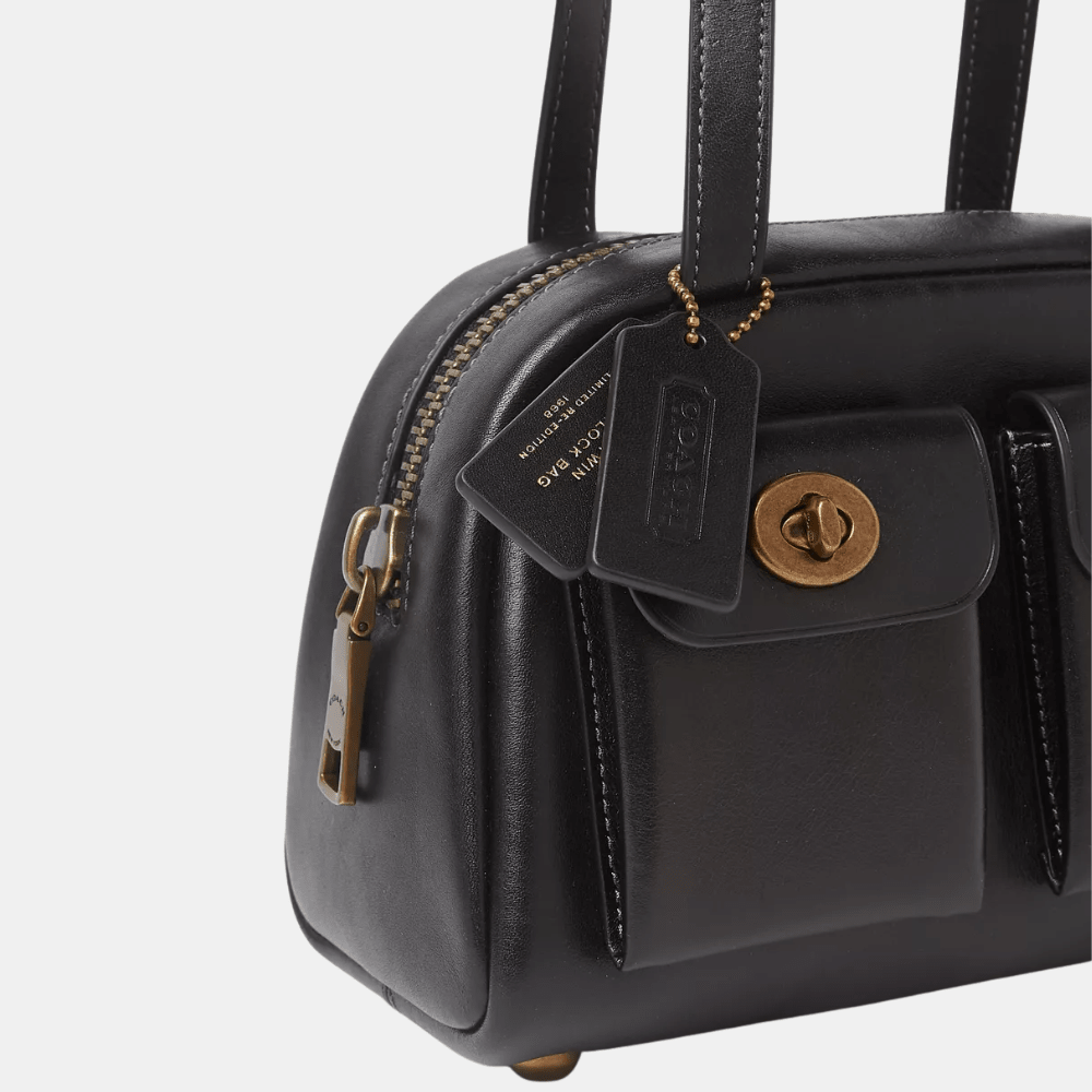 Buy Coach Twin Turnlock 20 Bag in Pakistan