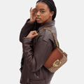Buy Coach Idol Bag In Signature Canvas With Snakeskin Detail in Pakistan