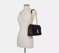Buy Coach Lane Shoulder Bag Gold Black in Pakistan